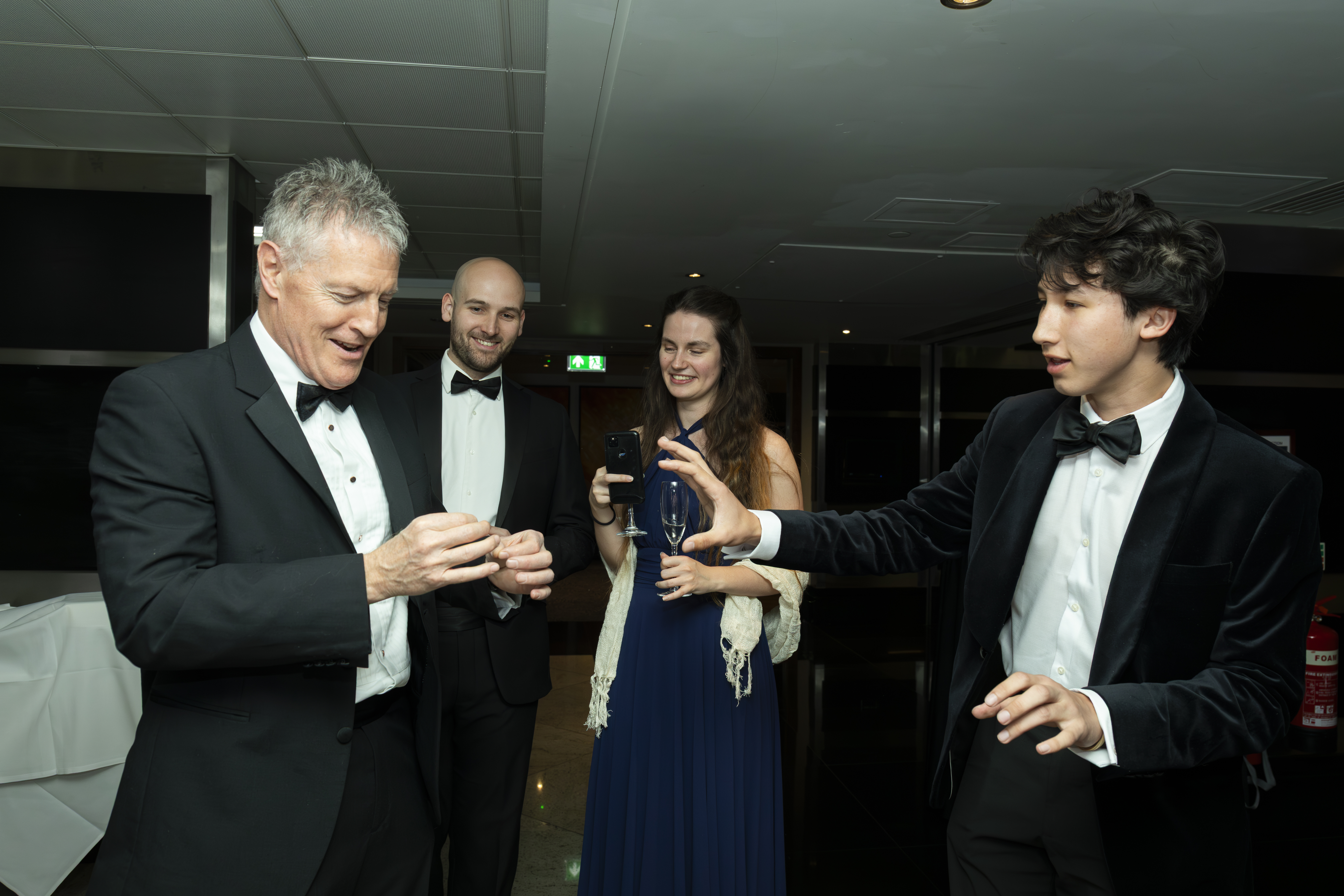 A guest enjoying a magic trick